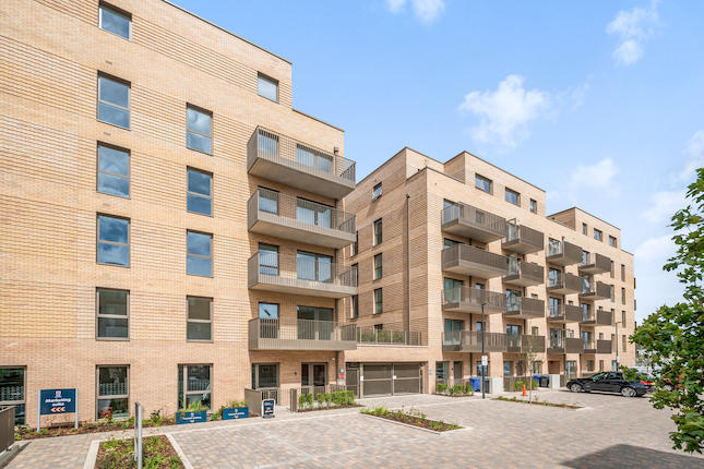 Modern apartment building representing newer property valuations